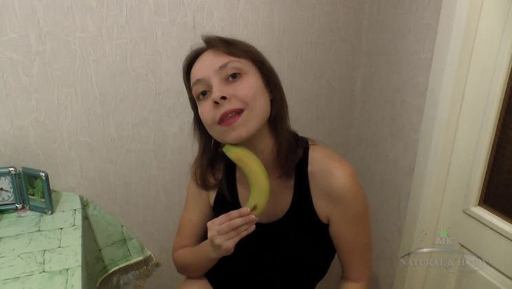 Sabrina poses and eats fruit
