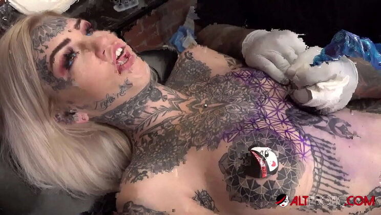Amber Luke Gets Tattooed While Sascha Plays with Her Big Tits